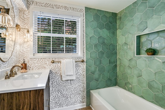 bathroom featuring vanity and a tub