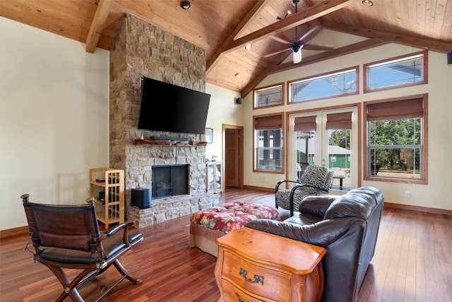 living room with dark wood-type flooring, a fireplace, beamed ceiling, wooden ceiling, and ceiling fan