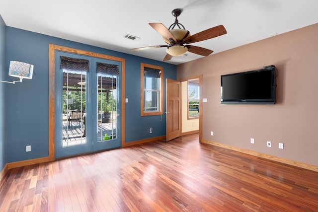 spare room with ceiling fan and wood-type flooring