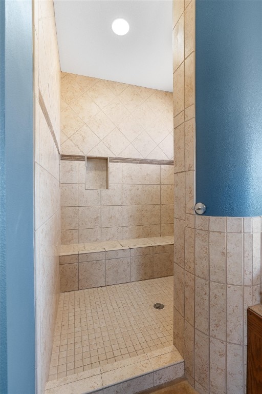 bathroom featuring tiled shower