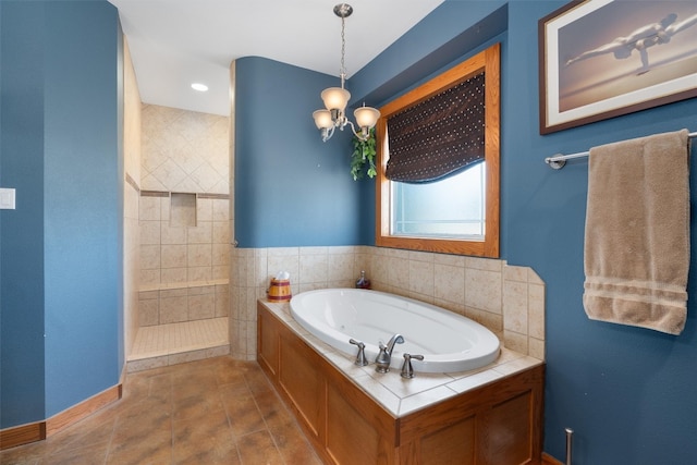 bathroom featuring separate shower and tub and tile patterned flooring