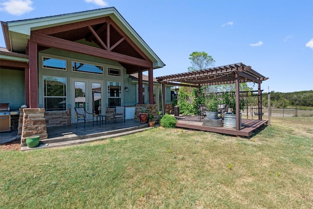 view of yard featuring a wooden deck and a pergola