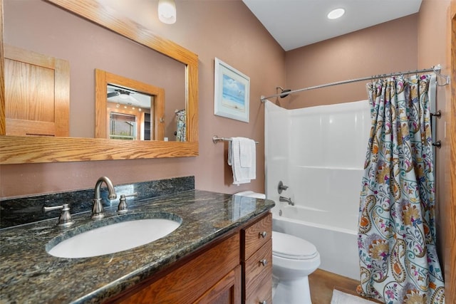 bathroom featuring shower / tub combo with curtain, vanity, and toilet