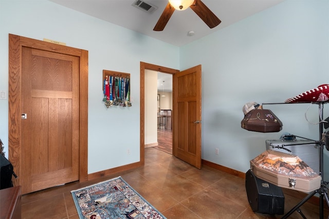 interior space featuring ceiling fan