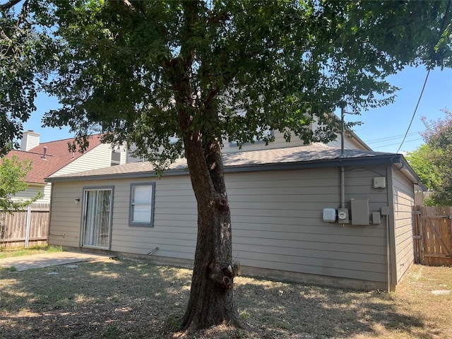 back of property featuring fence