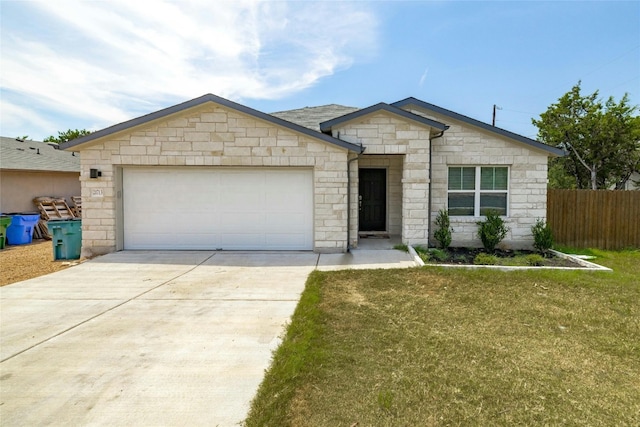 ranch-style house with a garage and a front yard