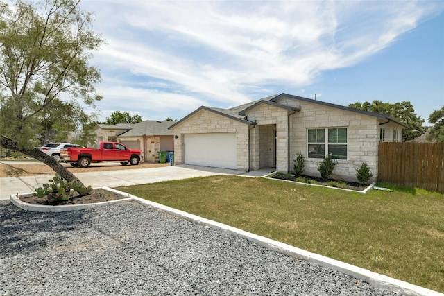 ranch-style home featuring a front lawn and a garage