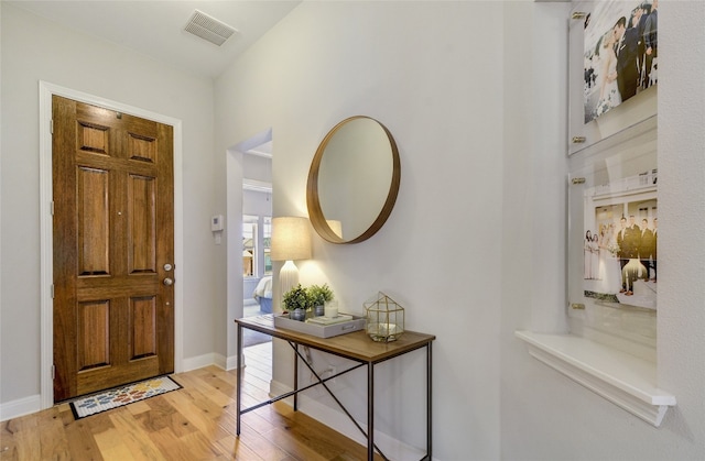 entryway with light hardwood / wood-style flooring