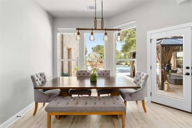 dining space featuring light hardwood / wood-style flooring