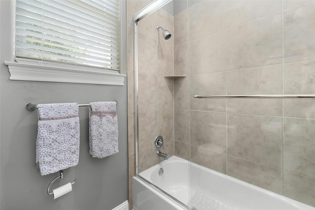 bathroom with enclosed tub / shower combo