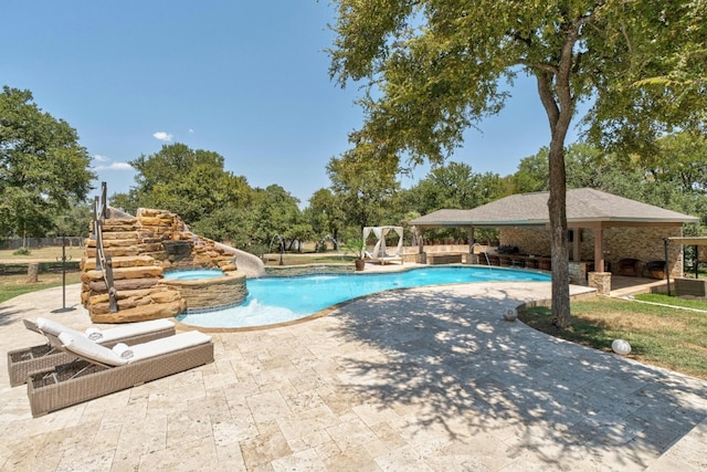 view of pool featuring a gazebo, a patio area, and an in ground hot tub