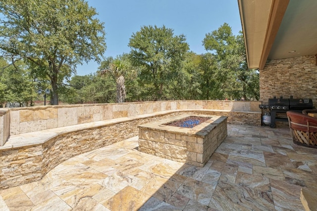 view of patio with a fire pit