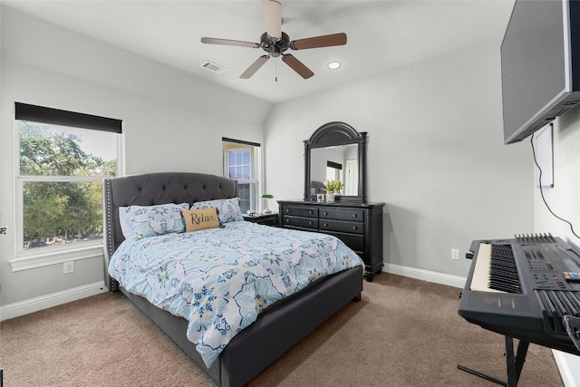 bedroom featuring ceiling fan, carpet floors, and vaulted ceiling