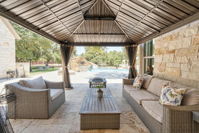 view of patio featuring a gazebo and an outdoor hangout area