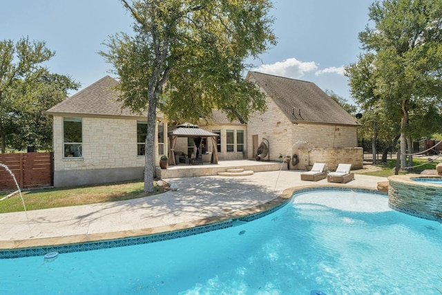 view of swimming pool featuring an in ground hot tub, a gazebo, and a patio