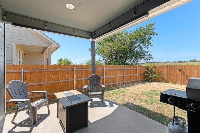 view of patio featuring a fenced backyard and grilling area