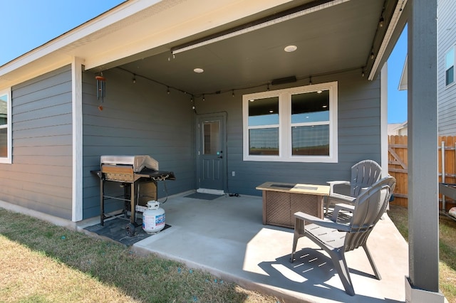 view of patio featuring a grill