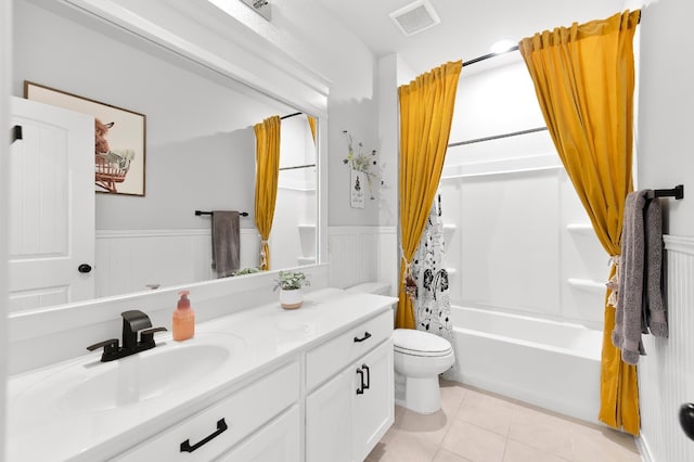 full bathroom featuring tile patterned flooring, vanity, toilet, and shower / bathtub combination with curtain