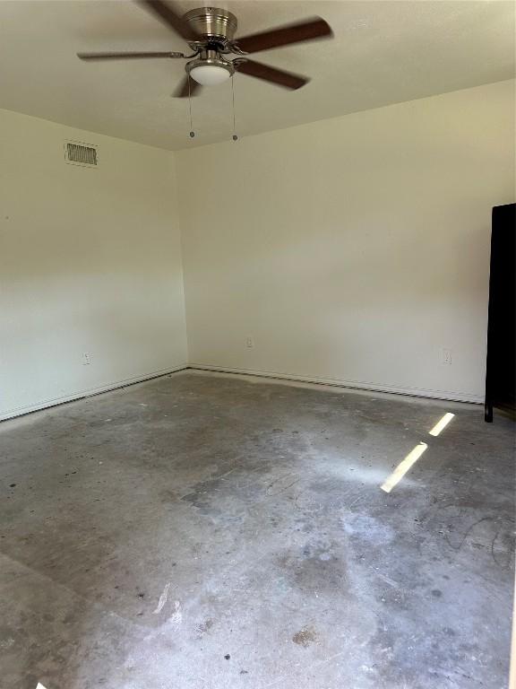 unfurnished room featuring visible vents and concrete flooring