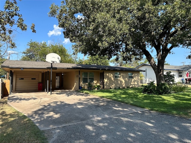 ranch-style house featuring a garage and a front yard