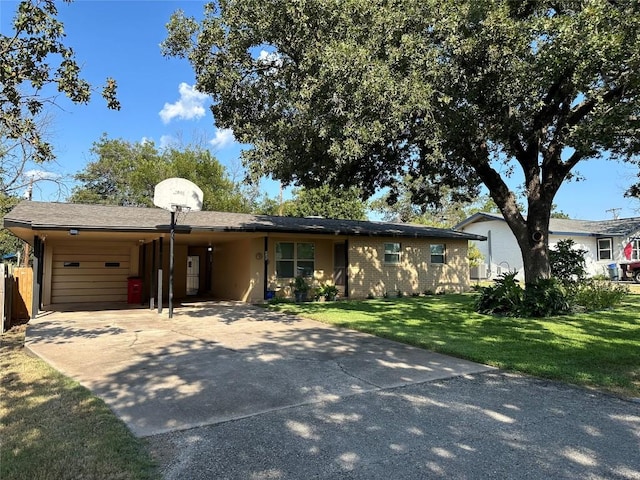 ranch-style home with a garage, a front yard, a carport, and concrete driveway