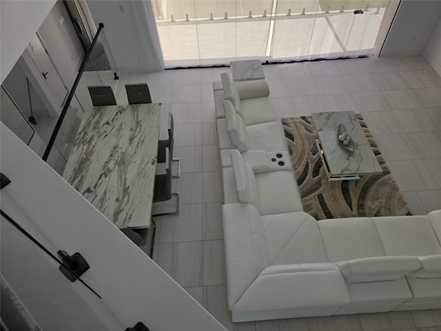 living room with tile patterned flooring and a wealth of natural light