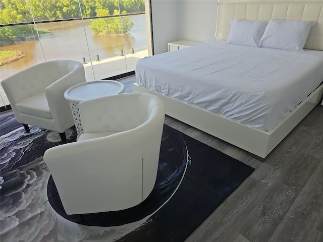 bedroom featuring dark hardwood / wood-style flooring