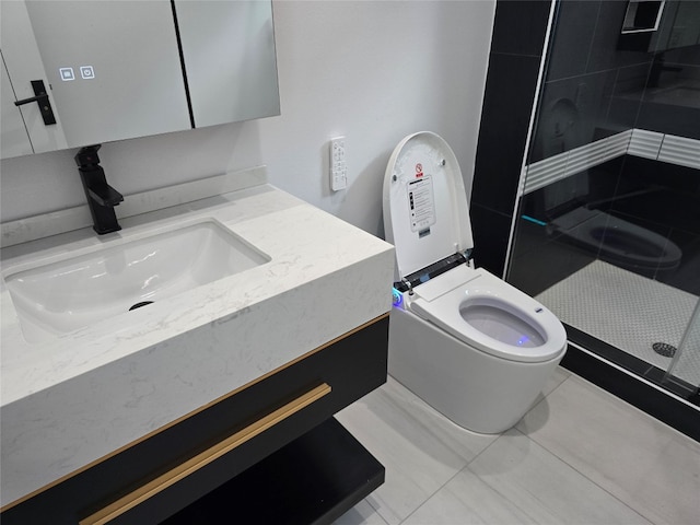 bathroom with a shower with shower door, vanity, and toilet