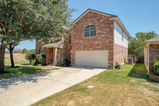 view of front property featuring central air condition unit, a front yard, and a garage