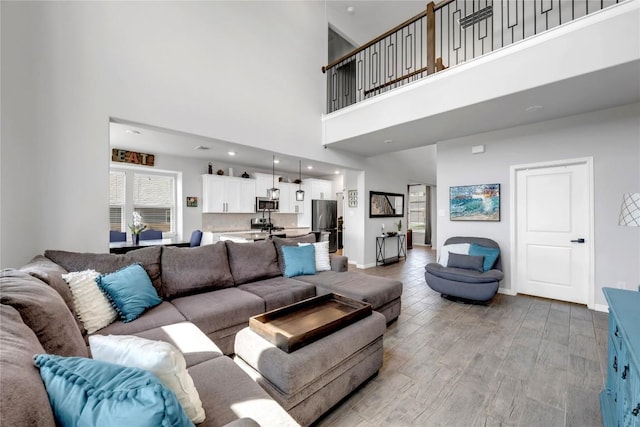 121 Woods Edge Ln, Georgetown, TX 78628 - living room with a towering ceiling and light wood finished floors