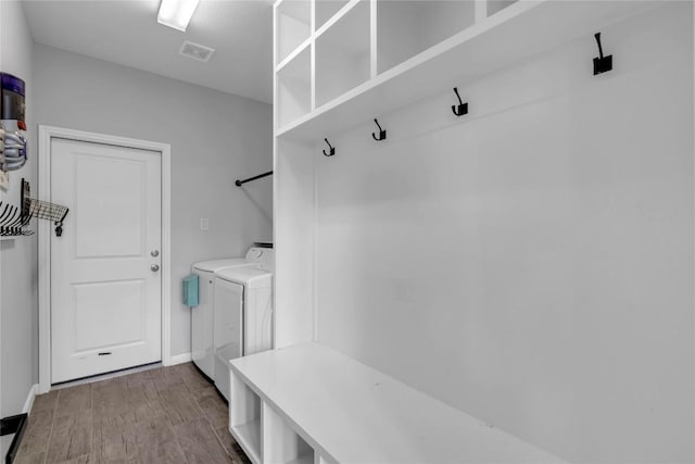 121 Woods Edge Ln, Georgetown, TX 78628 - mudroom with independent washer and dryer, dark wood-style flooring, and baseboards