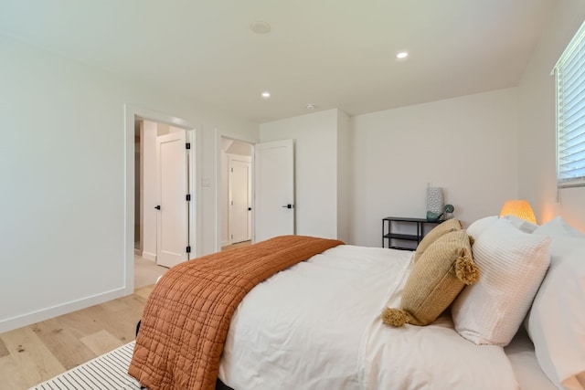 bedroom with light wood-type flooring