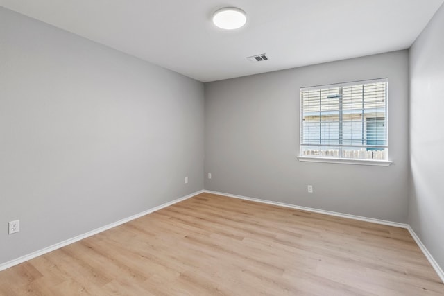 empty room featuring light hardwood / wood-style floors