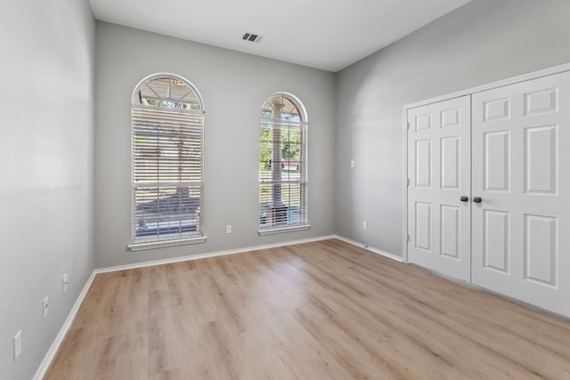 unfurnished bedroom with light hardwood / wood-style floors