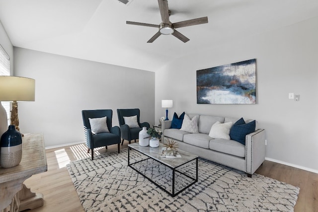 living room with ceiling fan and hardwood / wood-style floors