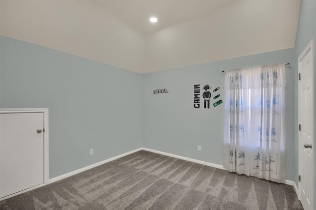 unfurnished room featuring lofted ceiling, recessed lighting, carpet, and baseboards