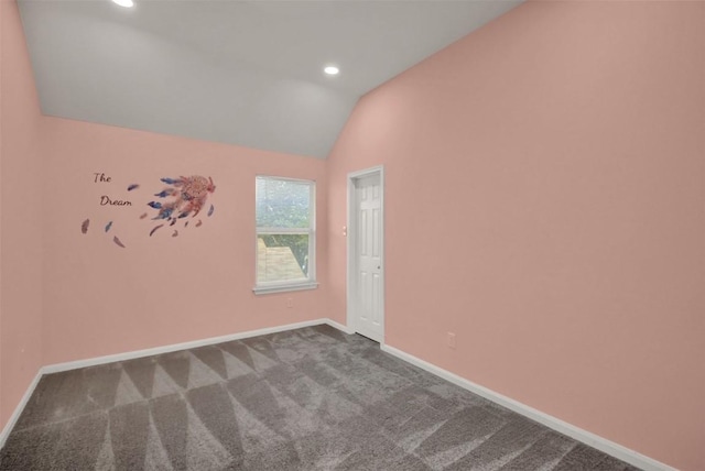 spare room featuring vaulted ceiling, carpet floors, recessed lighting, and baseboards