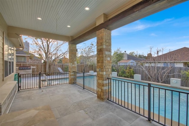 view of patio featuring a fenced backyard and a fenced in pool