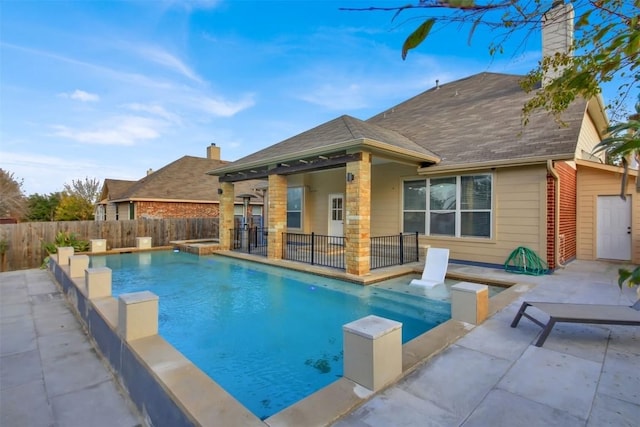 view of pool with a fenced in pool, a patio area, and fence