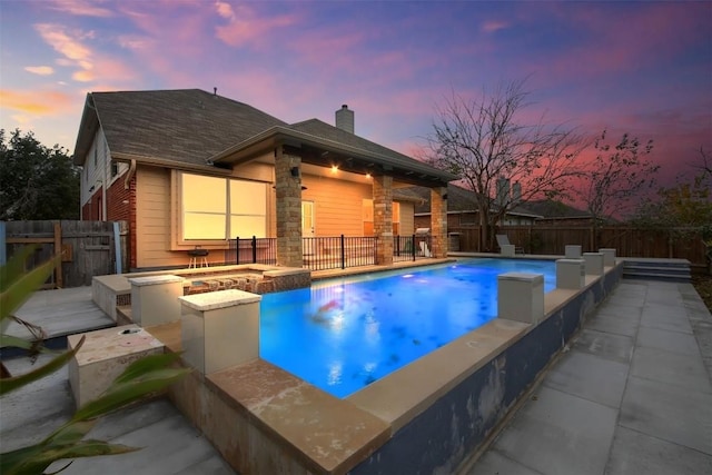 view of swimming pool with a fire pit, a patio area, a fenced backyard, and a fenced in pool