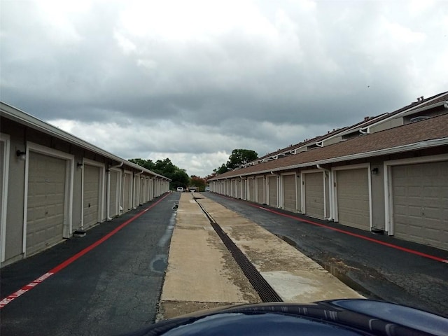 view of road with community garages