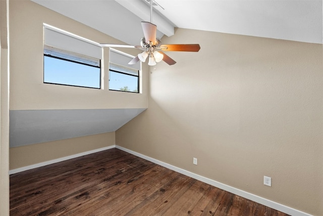 unfurnished room with hardwood / wood-style flooring, vaulted ceiling with beams, and ceiling fan