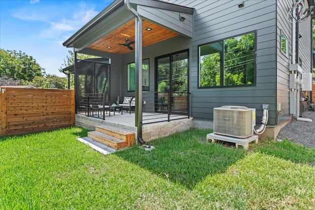 exterior space with ceiling fan, central AC unit, and a patio area