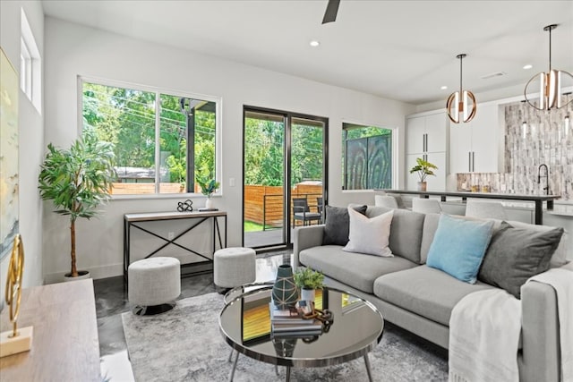 living room with a notable chandelier