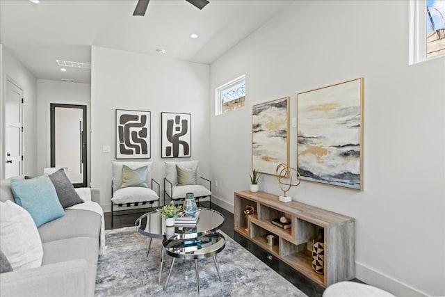 living room with ceiling fan and hardwood / wood-style floors