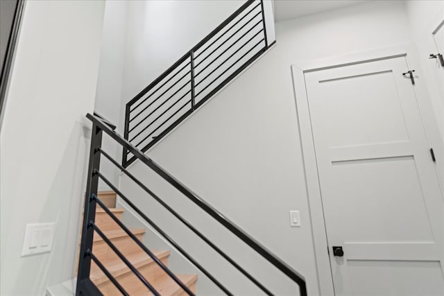 stairway with wood-type flooring