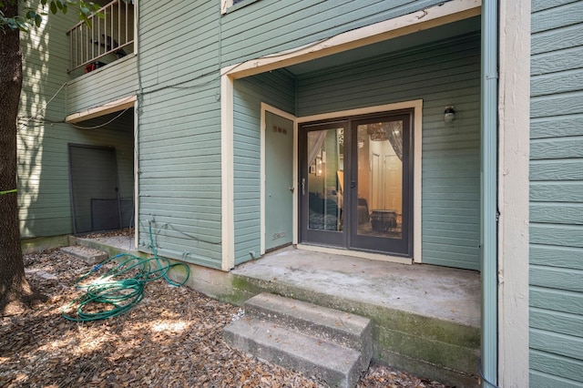 entrance to property with a balcony