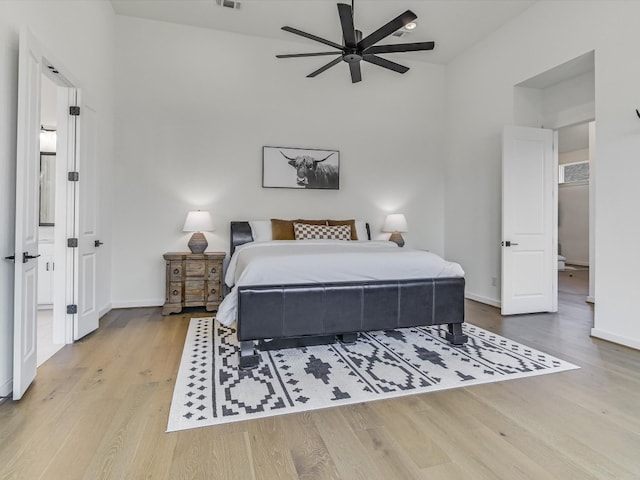 bedroom featuring ceiling fan and light hardwood / wood-style flooring