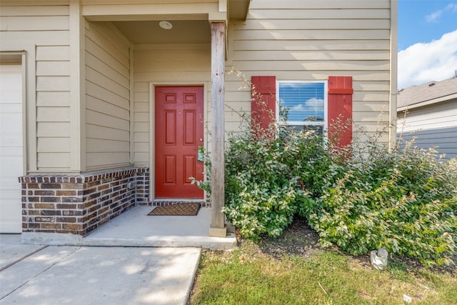 entrance to property featuring a garage