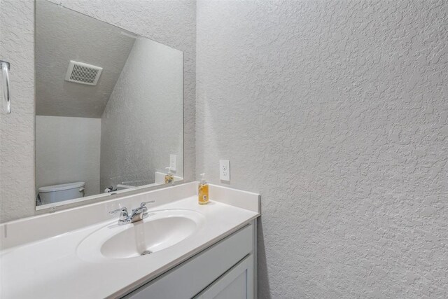 8236 Brucks Dr, San Antonio, TX 78244 - bathroom with a textured wall and vanity